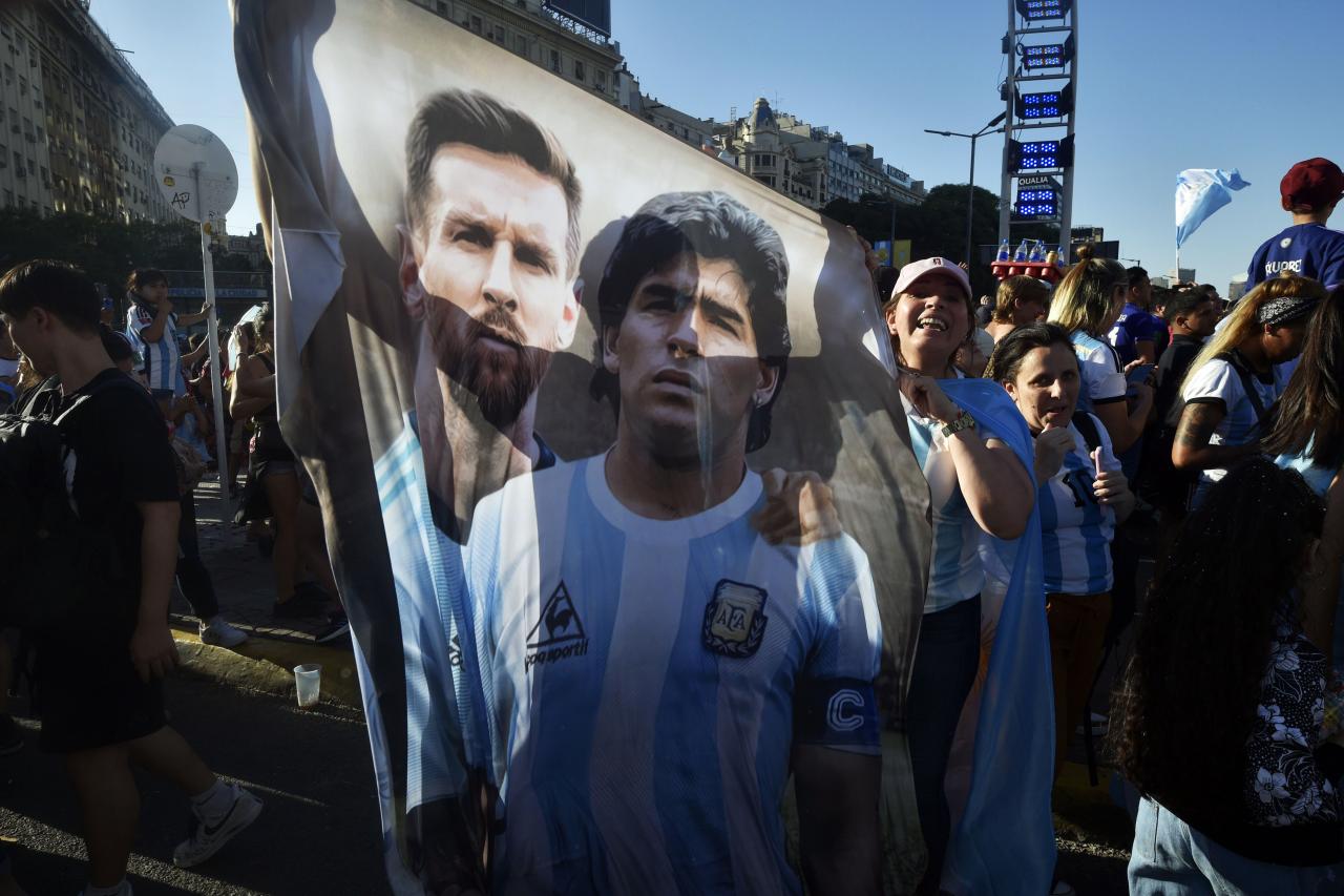Soccer legend Maradona is cheering Lionel Messi from heaven, Argentina fans sing ahead of World Cup final