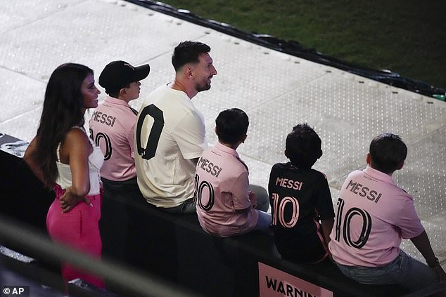 The Messi family - with the three children all wearing their dad's jersey - watched the show