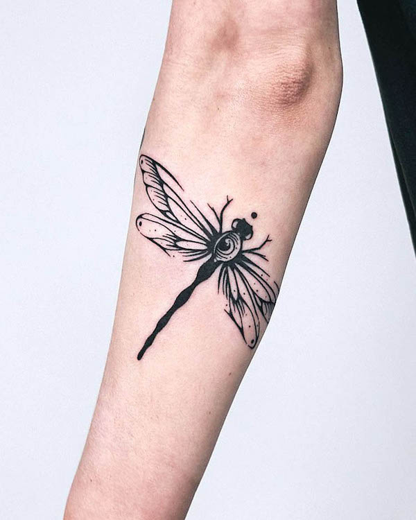 Bold dragonfly blackwork by @myrkur_tattoo