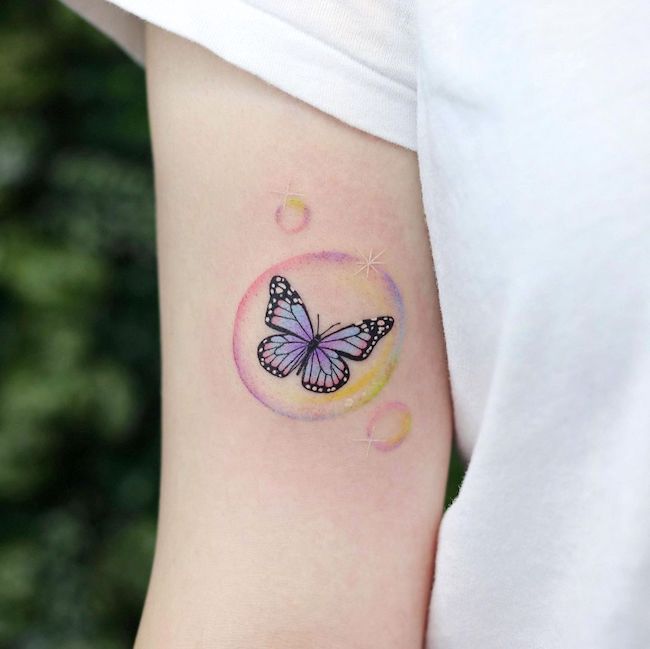 Butterfly in bubble by @nara_tattooo