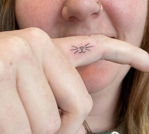Cat tattoo on a finger