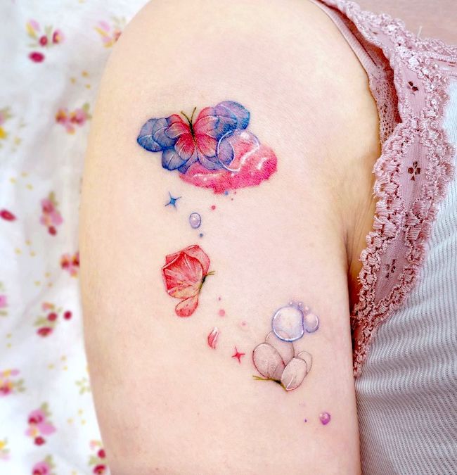 Dreamy bubbles and butterflies tattoo by @songe.tattoo