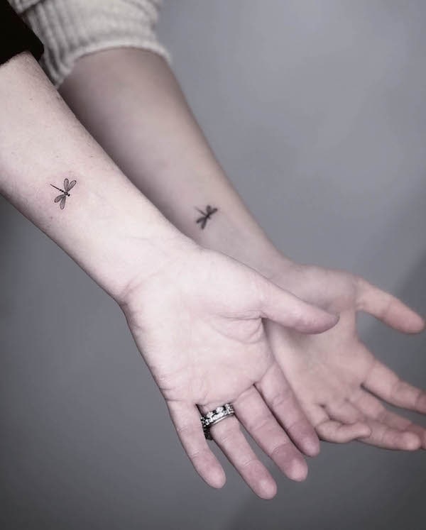 Matching dragonfly wrist tattoos by @west4tattoo