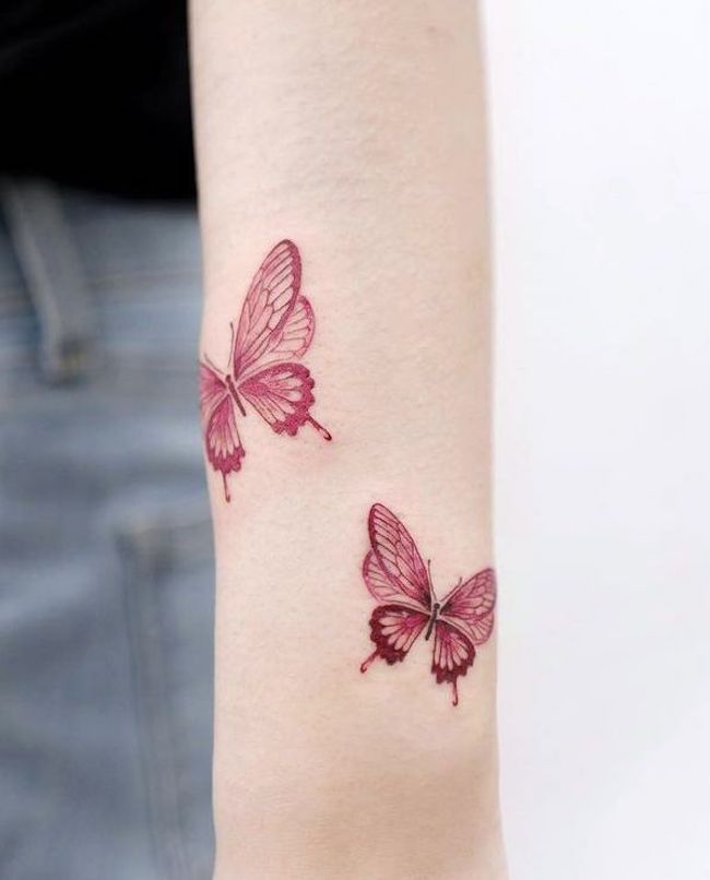 Red butterflies wrist tattoo by @choiyun_tattoo