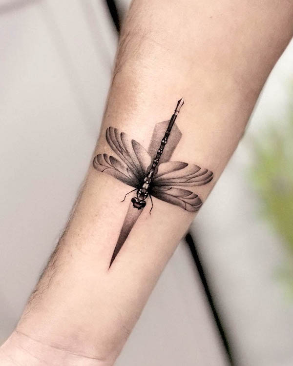 Sleek dragonfly tattoo for men by @painciler