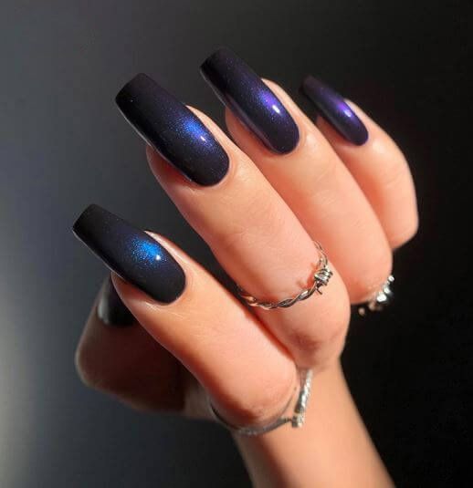 Black nail color with vast galaxy-inspired nail art on long tapered square nails