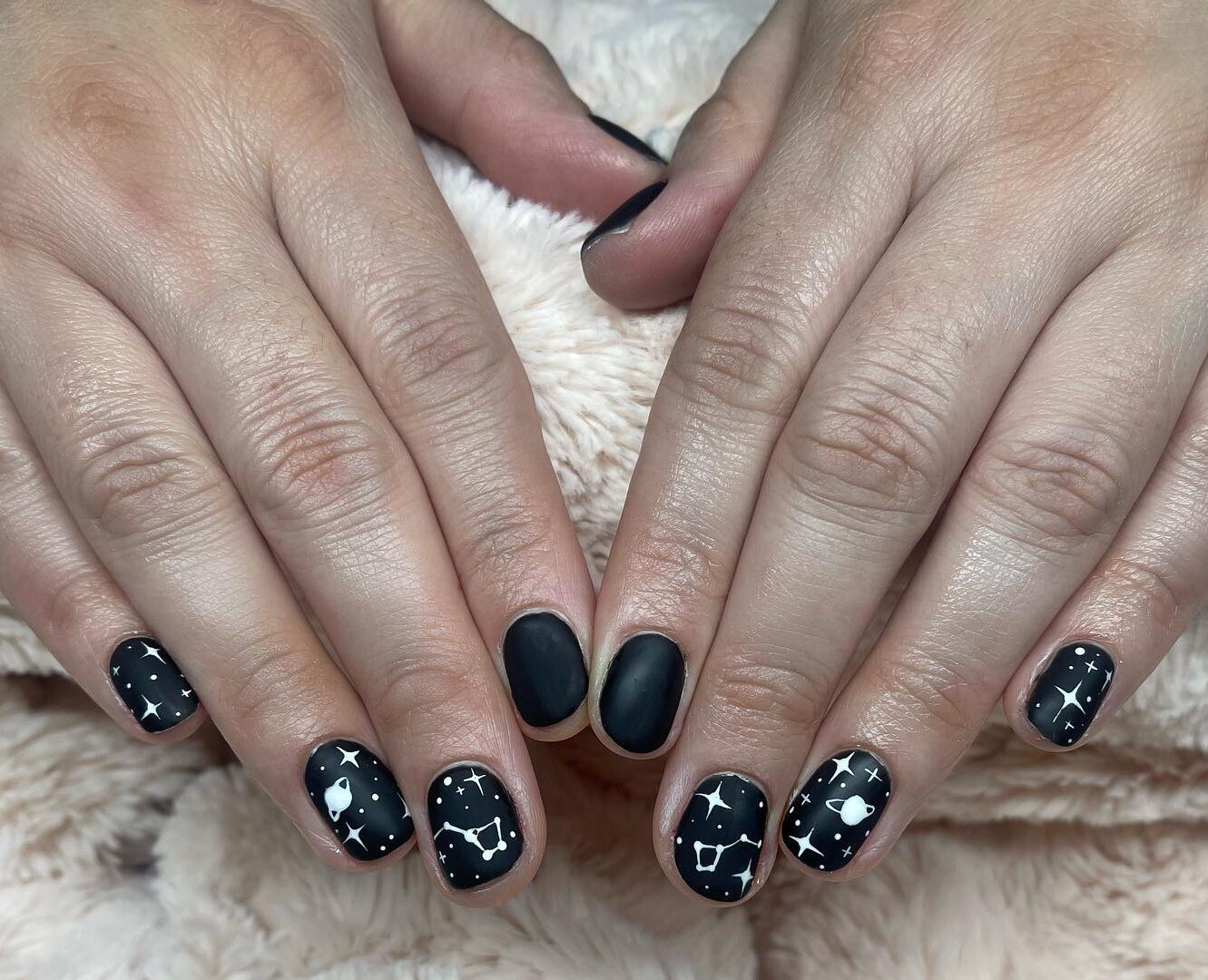 Black nail color in matte finish with galaxy nail arts on short nails