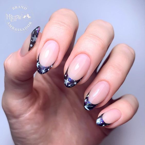 Deep purple French tips with galaxy-inspired nail art on medium round nails