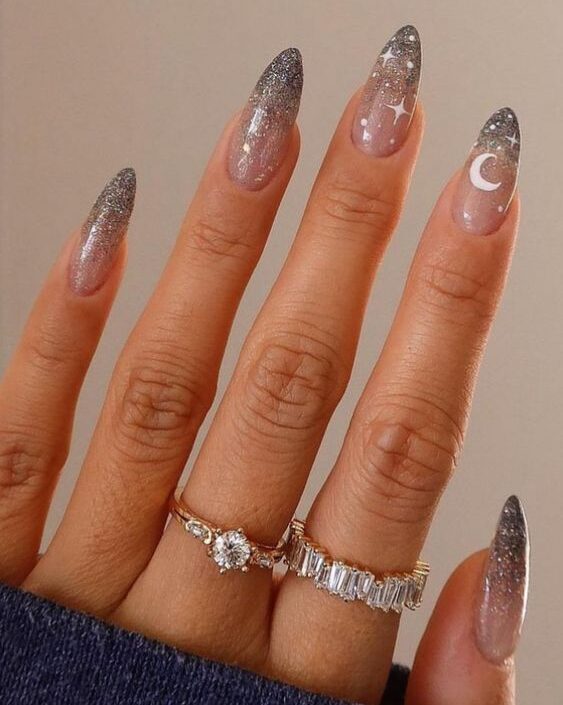 Silver glitters ombre effect with minimalist galaxy nail arts on long almond nails