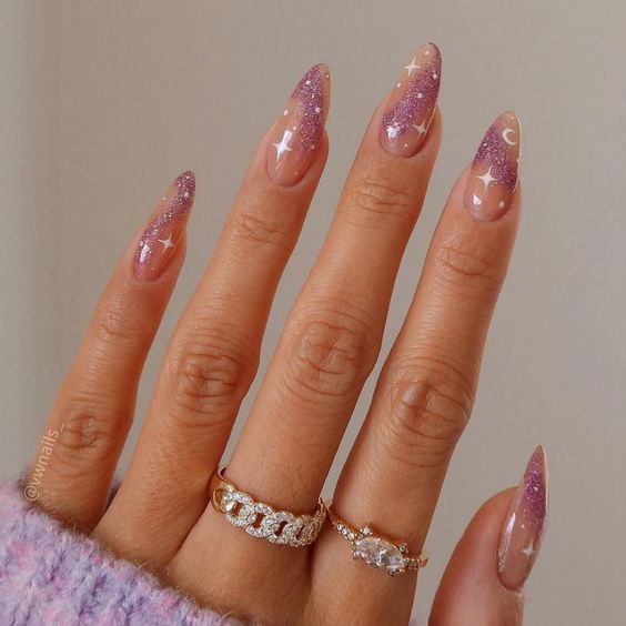 Minimalist galaxy nail art with pink glitters on long almond nails