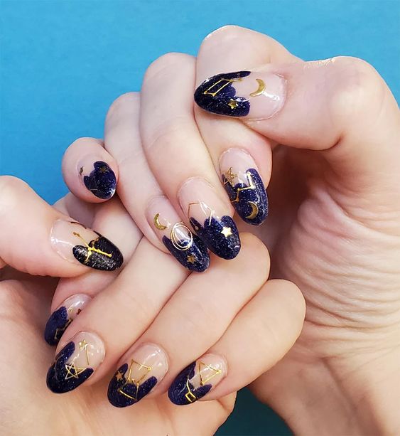Purple abstract French tips with gold celestial elements nail designs on long round nails