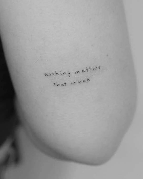 Meaningful quote tattoo above elbow by @m3.ink