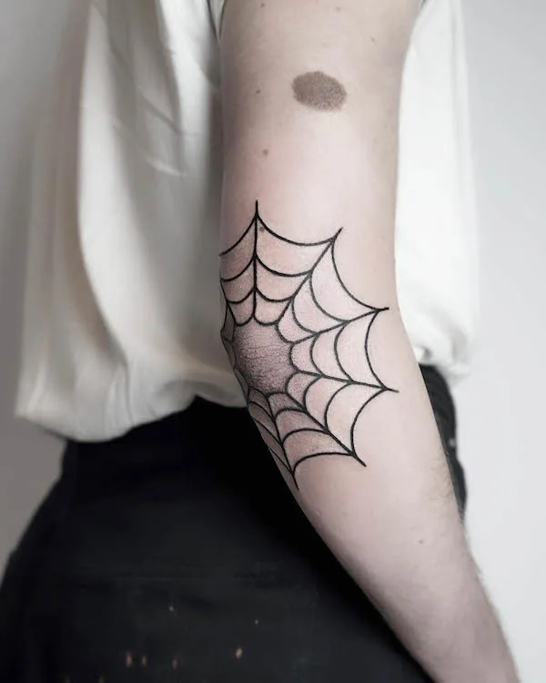 Spider web elbow tattoo by @maia_forster