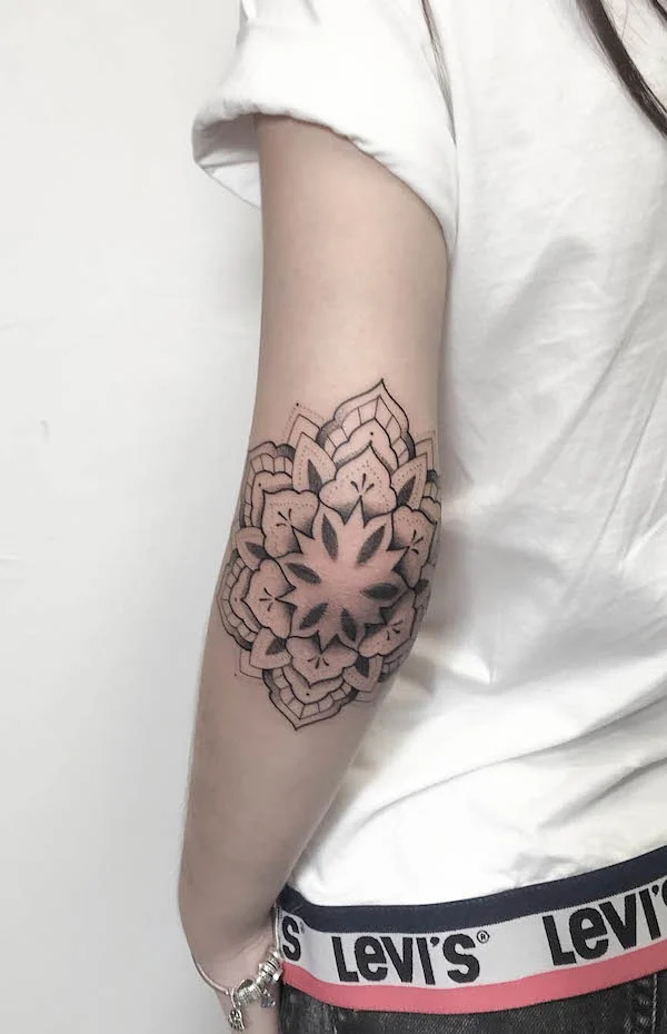 Blackwork elbow mandala tattoo by @uappins