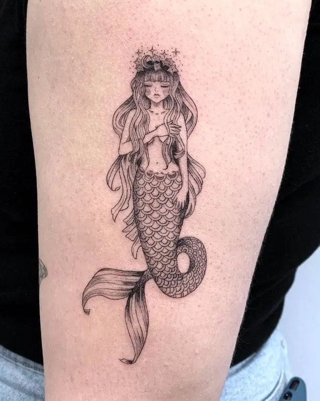 A intricate girly mermaid tattoo by @ink.by.kiki
