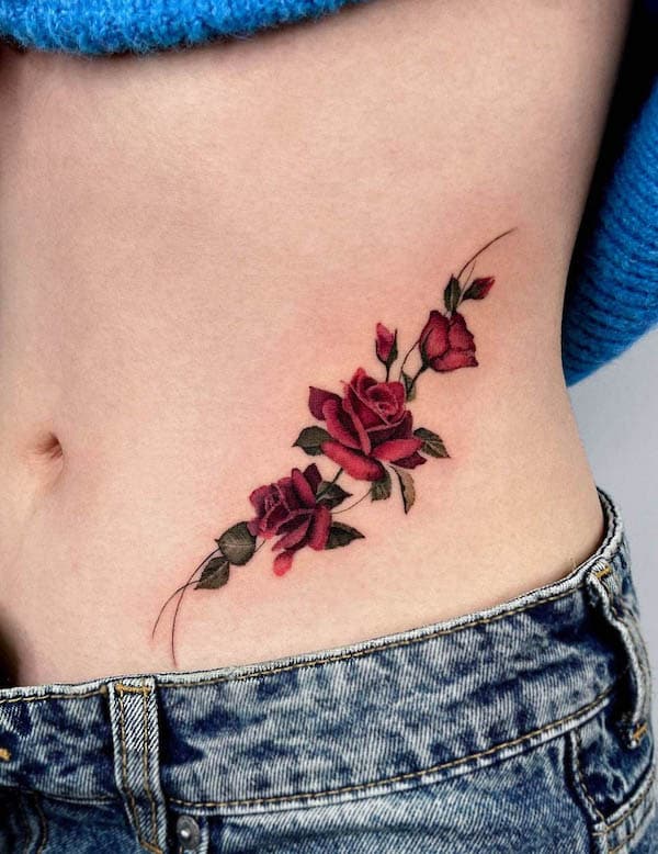 Beautiful rose waistline tattoo by @mooji_tt