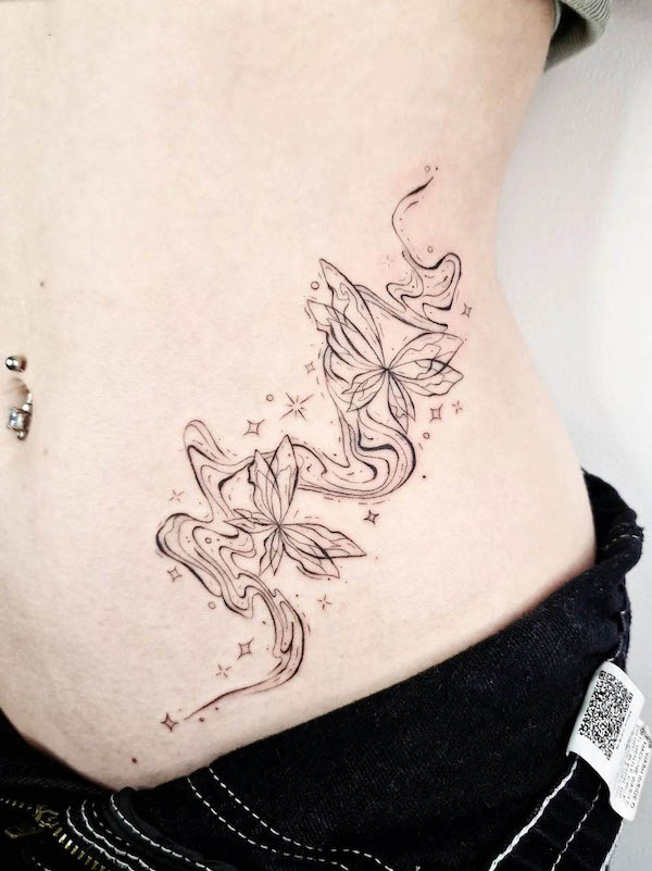 Trippy lines and butterfly waist tattoo by @_cloudy.ink_