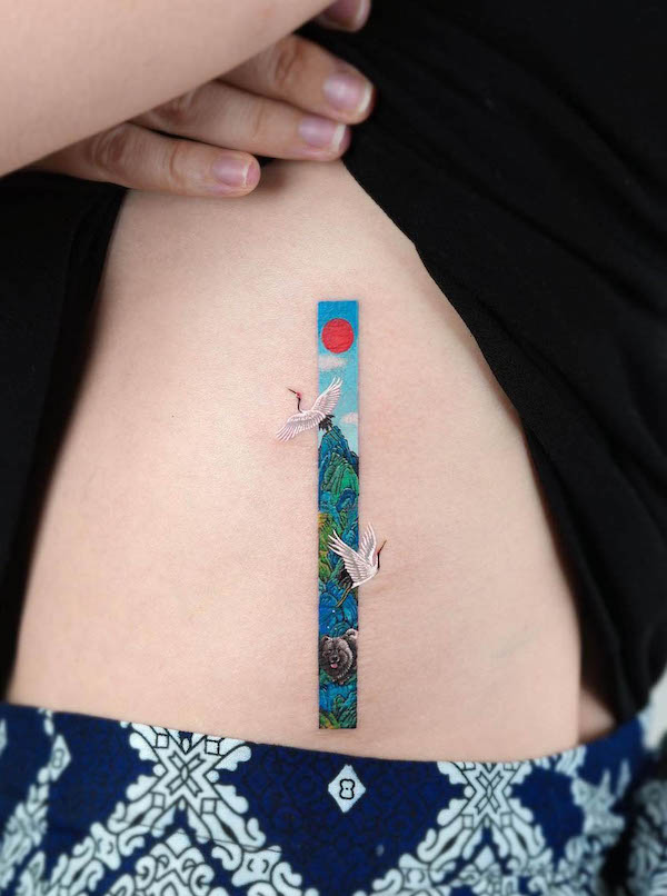 Crane and mountains waist tattoo by @tattooist_eq