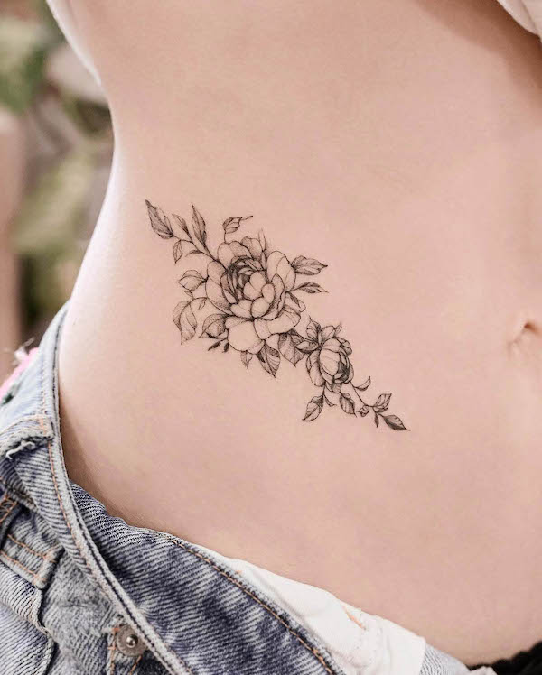 Flowers and leaves waist tattoo by @eat_my_pen