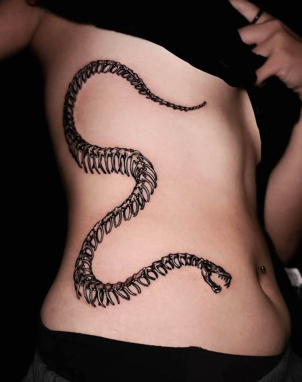 Skeleton snake waist tattoo by @aweichen666_tattoo