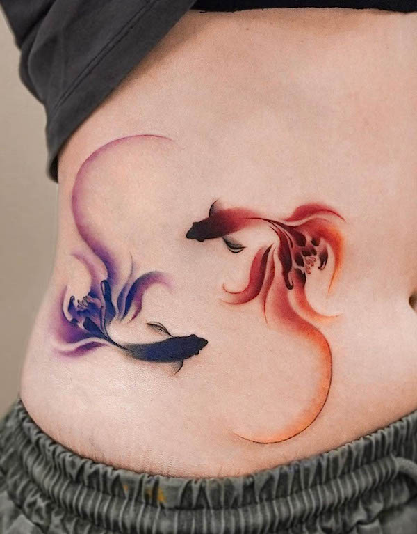 Double koi fish waist tattoo by @leean.ink