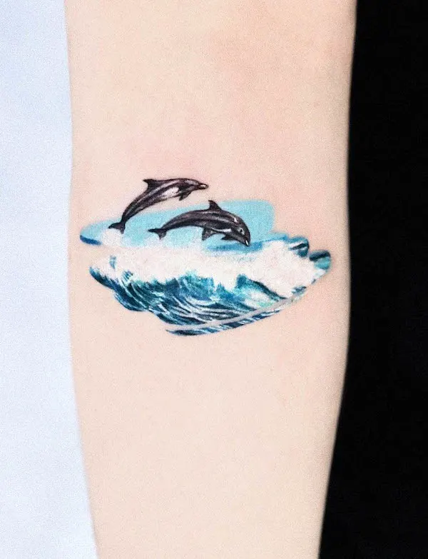 Dolphins tattoo by @tattooist_mul