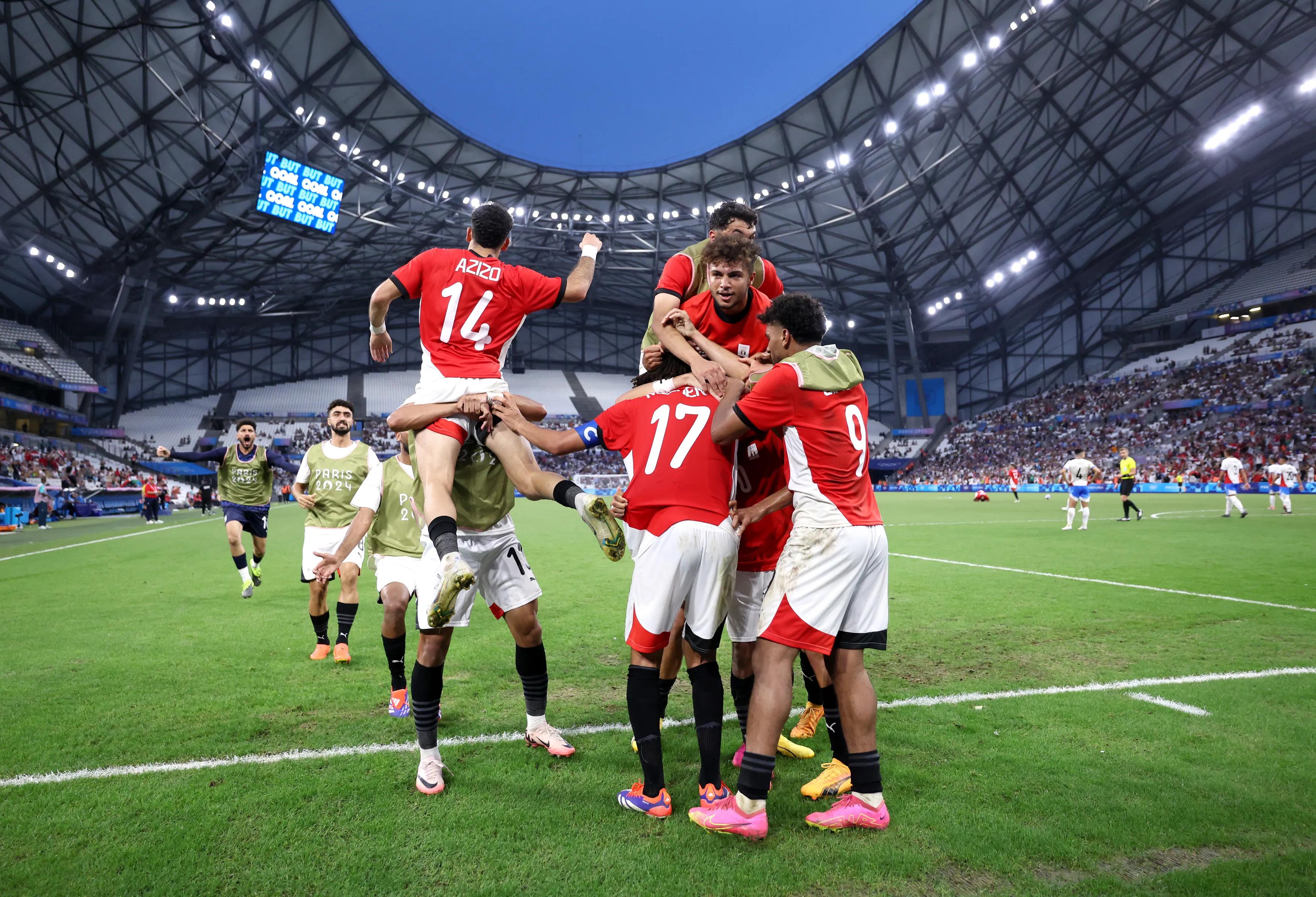 MARSEILLE, FRANCE - AUGUST 02: Adel Ibrahim #10 of Team Egypt celebrates with teammates after scoring his team's first goal during the Men's Quarterfinal match between Egypt and Paraguay during the Olympic Games Paris 2024 at Stade de Marseille on August 02, 2024 in Marseille, France. (Photo by Alex Livesey/Getty Images)