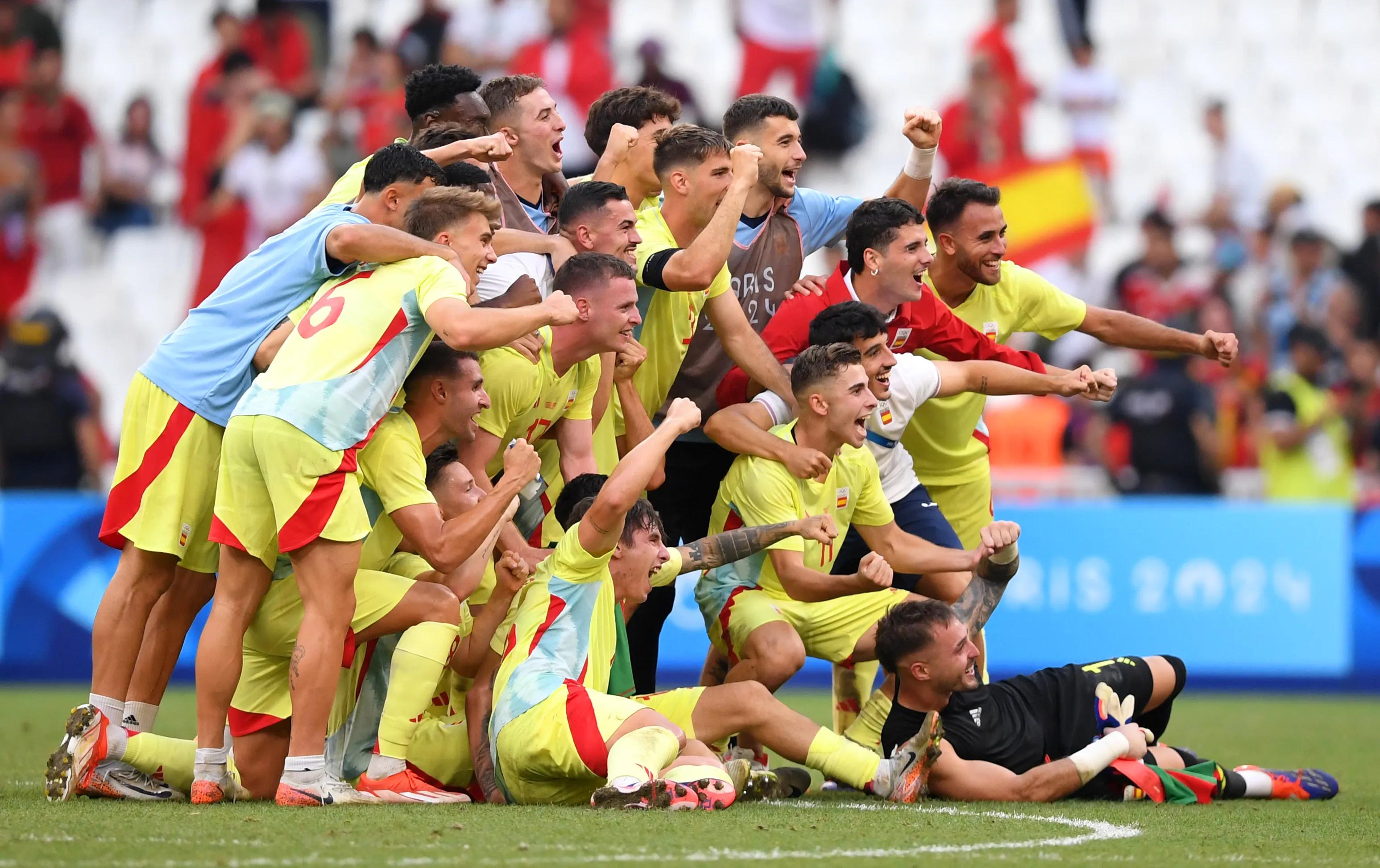 MARSEILLE, FRANCE - AUGUST 05: Players of Team Spain celebrate victory after the Men's semifinal match between Morocco and Spain during the Olympic Games Paris 2024 at Stade de Marseille on August 05, 2024 in Marseille, France. (Photo by Harriet Lander - FIFA/FIFA via Getty Images)