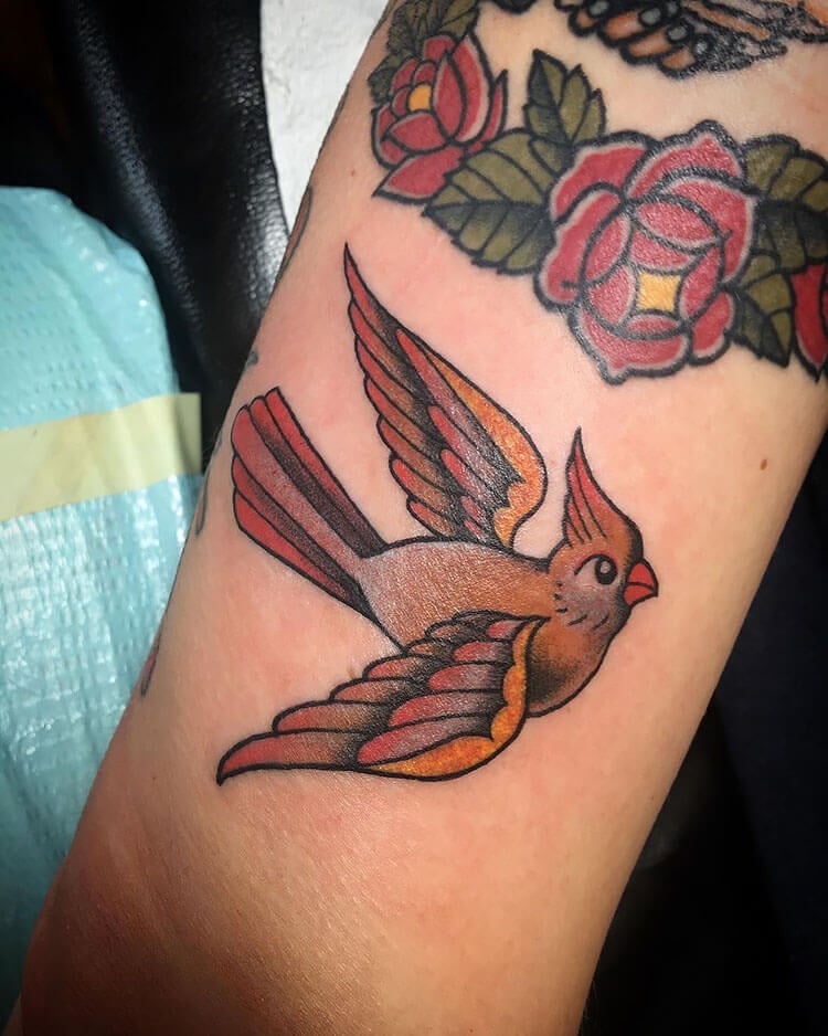 swallow bird with flowers tattoo