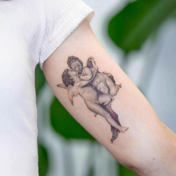 Baby Angel cupid tattoo