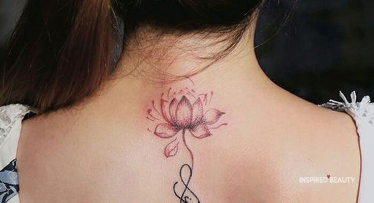 red nad black ink lotus design tattoo on woman