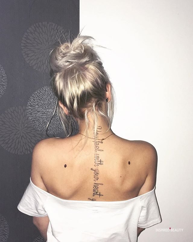 women's tattoo on back