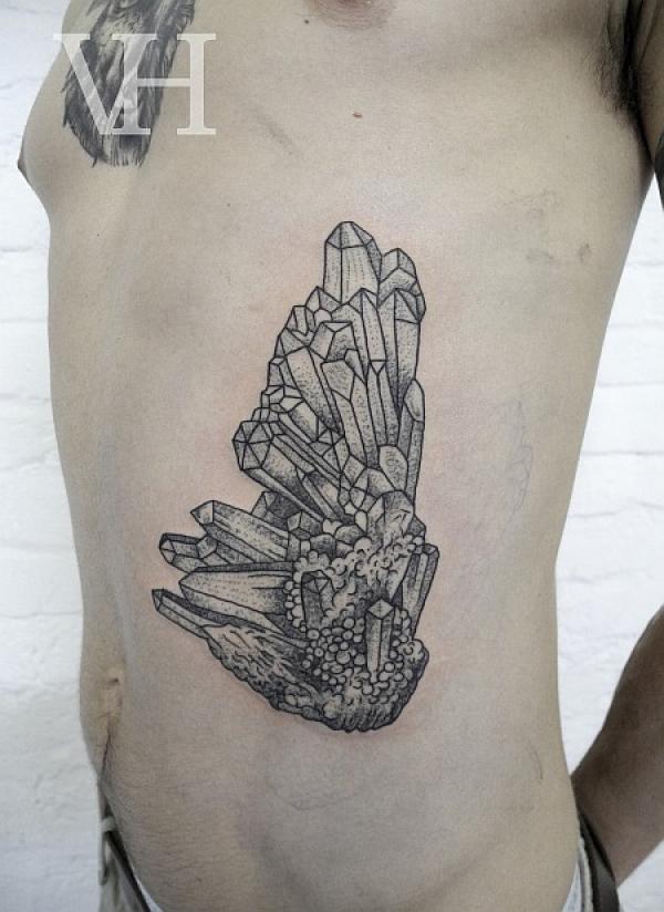 Crystal side tattoo