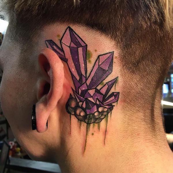 Crystal tattoo behind the ear