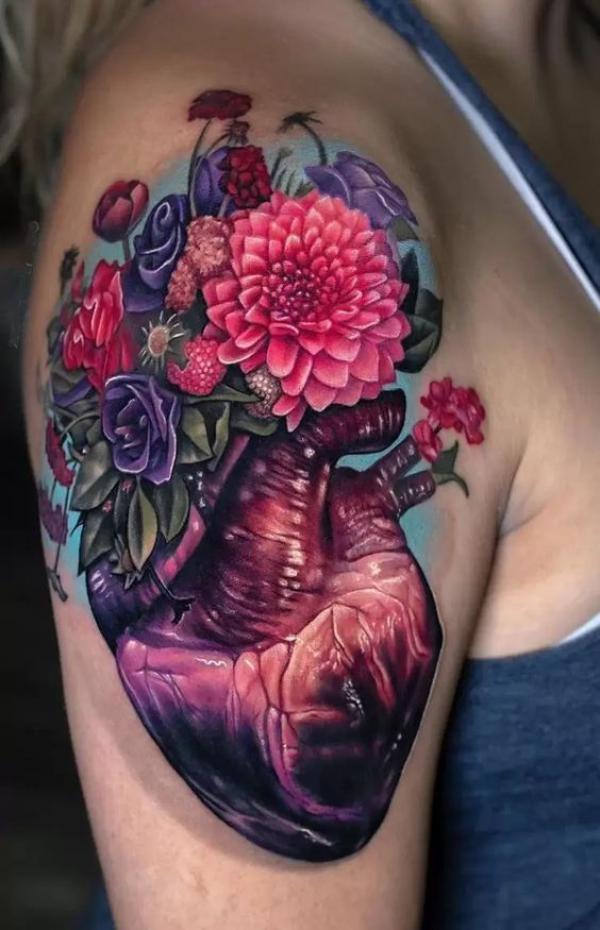 Human heart with dahlia tattoo