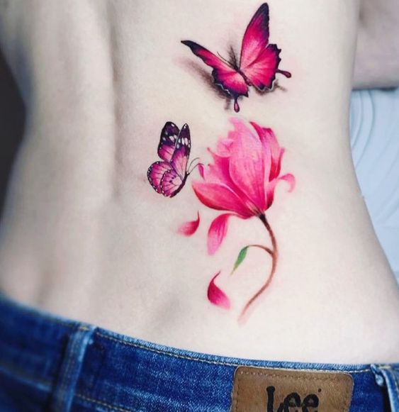 Red butterfly and flower tattoo on one side of back