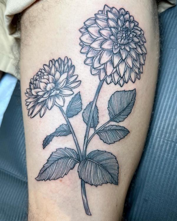 Two black and grey dahlia flowers tattoo